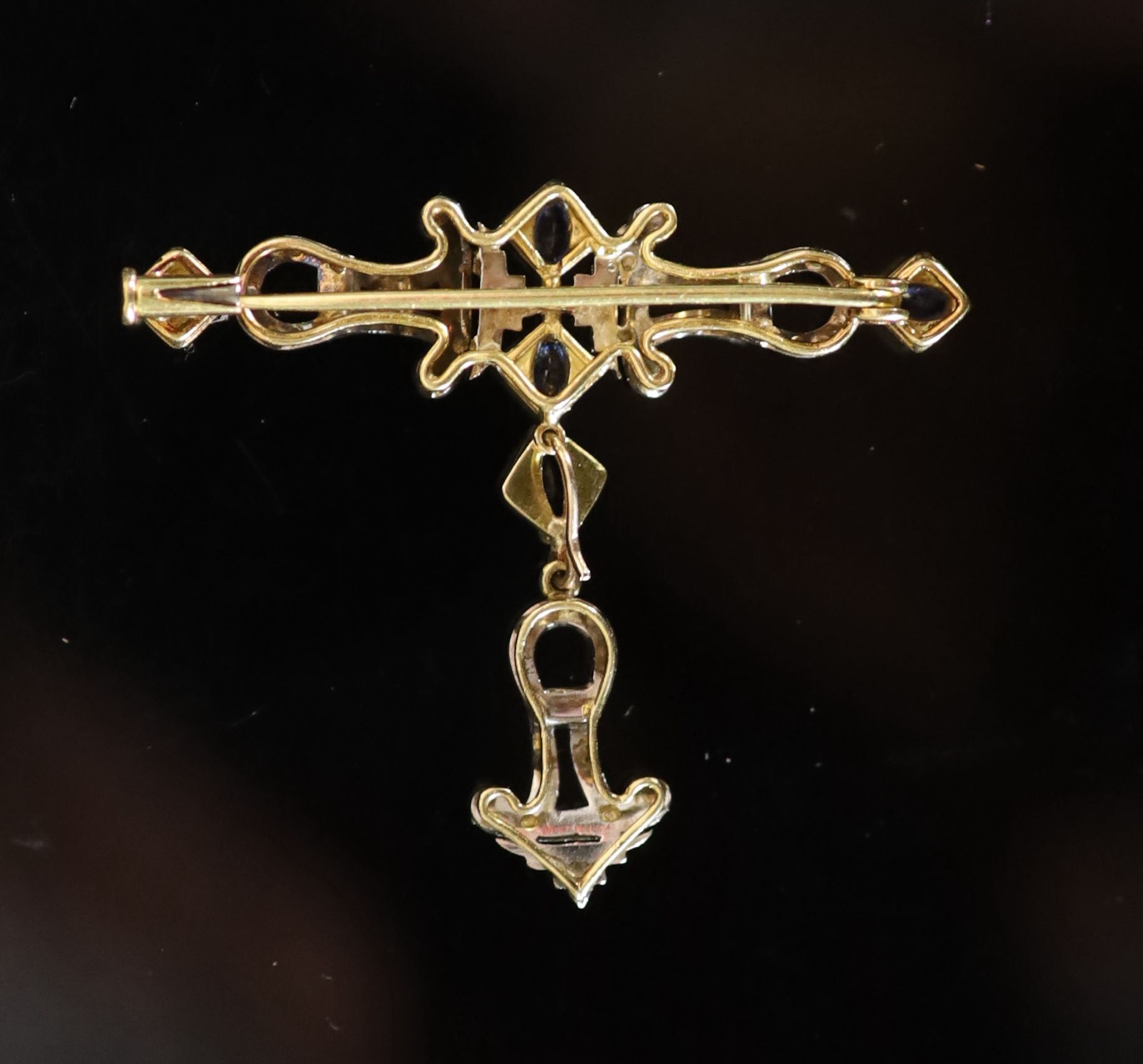 A mid 20th century gold, sapphire and diamond set drop openwork bar brooch